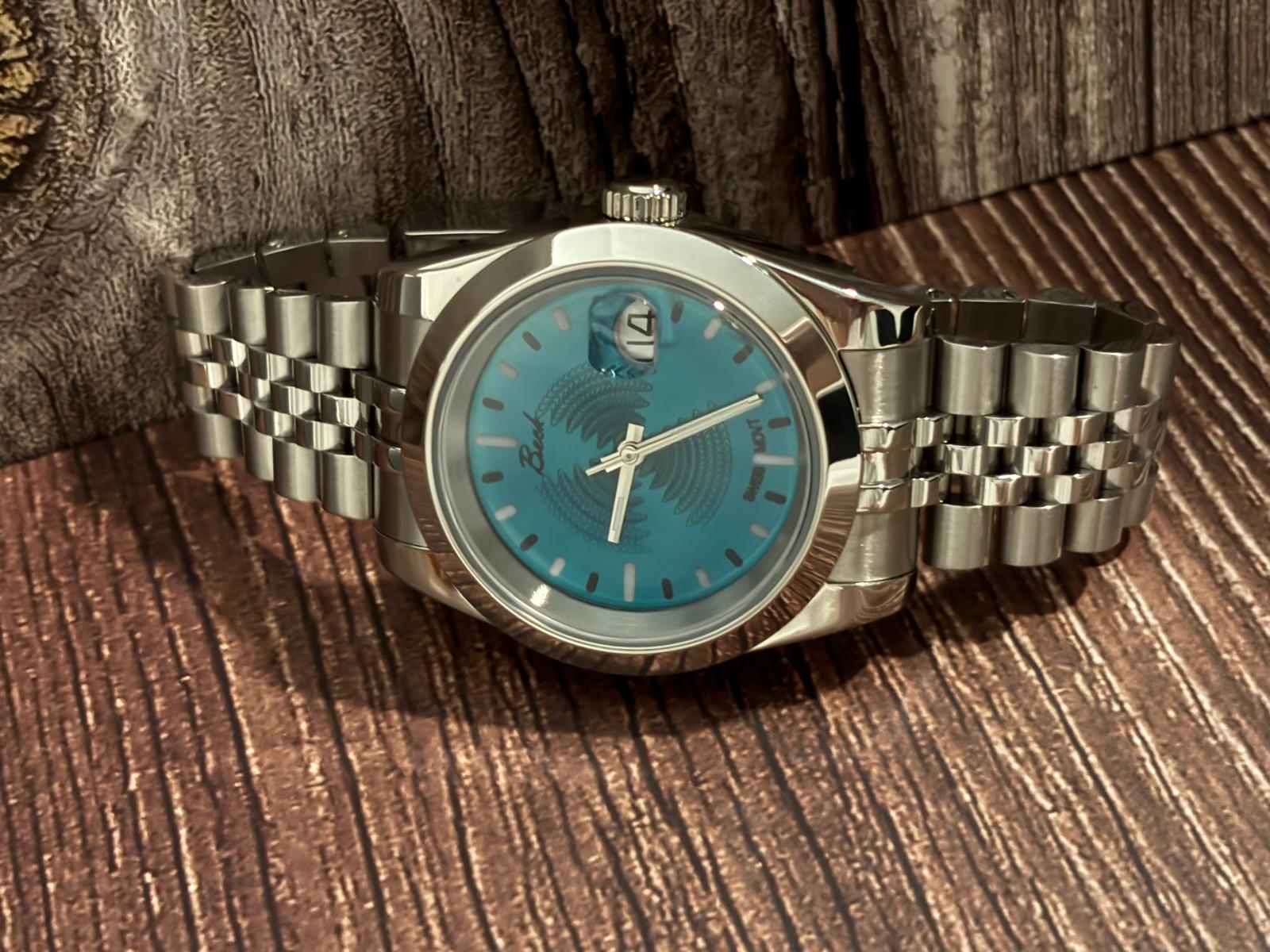 Beck Solaris Azure 25111 – Candy Blue guilloché  dial, 40mm 316 stainless-steel case, slanted bezel, Executive solid-link bracelet, Swiss movement SW200 $1,199.00 
